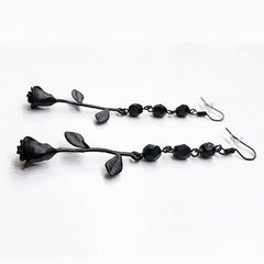 Dangling earrings in gothic style with a rose