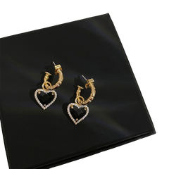 Earrings in retro style with a black heart