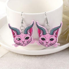 Earrings in the shape of gothic cats